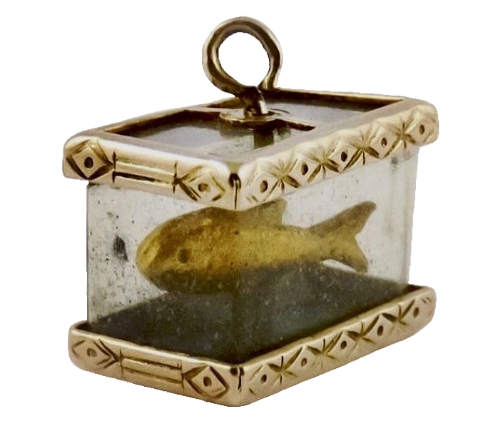 a small bronze fish in a glass charm tank